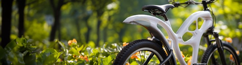 Modern bicycle with an innovative frame design parked in a lush green park